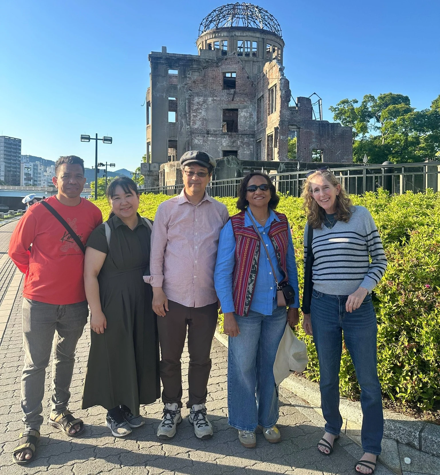 Minister Dulce de Jesus and delegation paying tribute at the Hiroshima Atomic Bombing Memorial Monument.