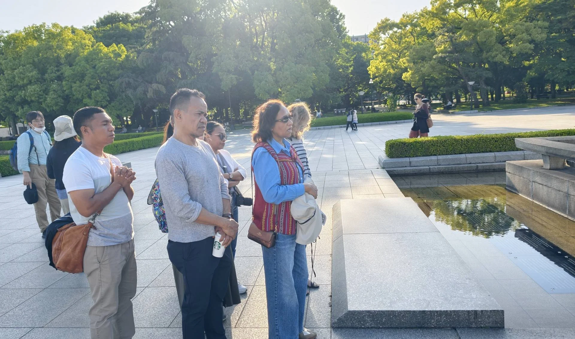 Minister Dulce de Jesus and delegation paying tribute at the Hiroshima Atomic Bombing Memorial Monument.