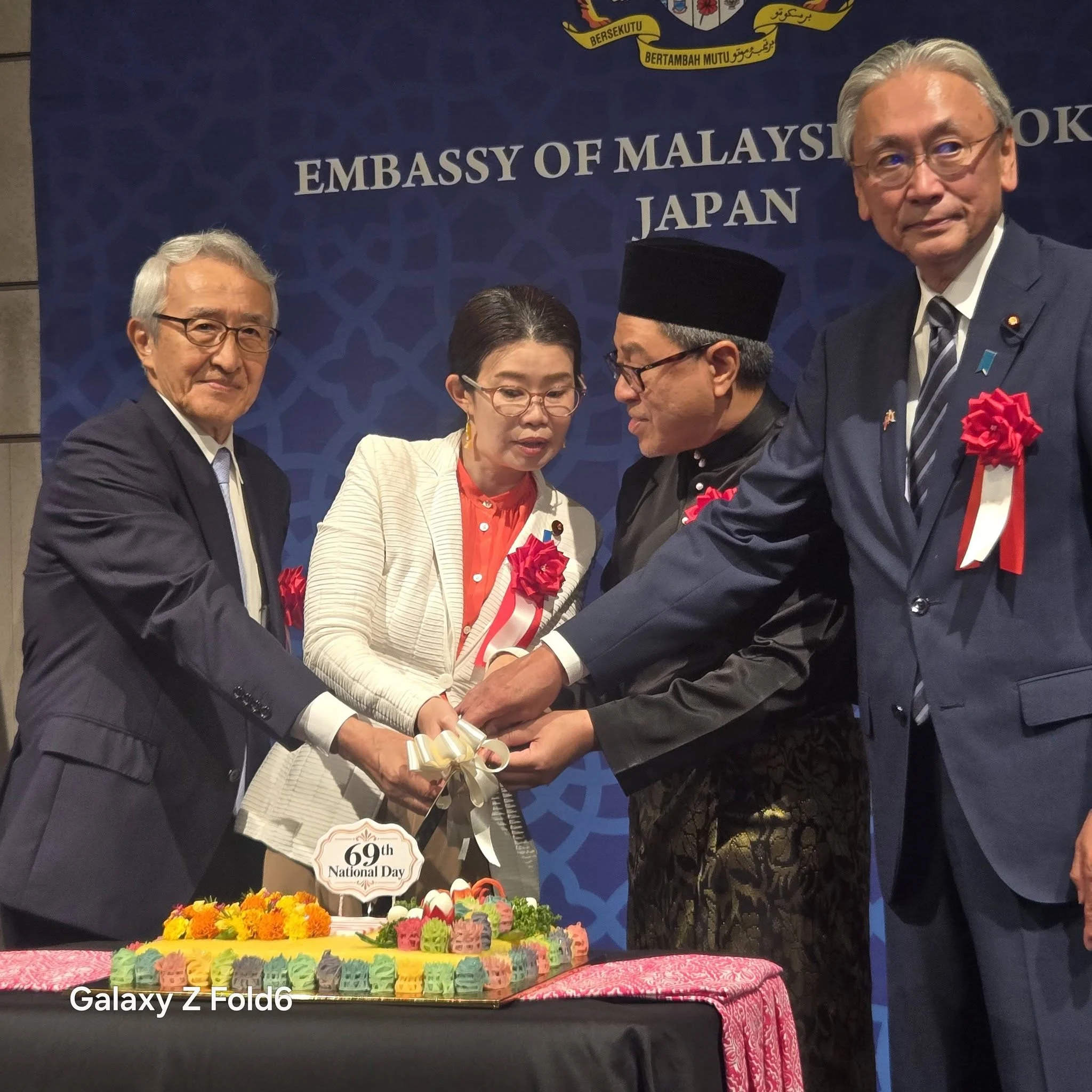 Cake cutting ceremony commemorating the 69th National Day of Malaysia