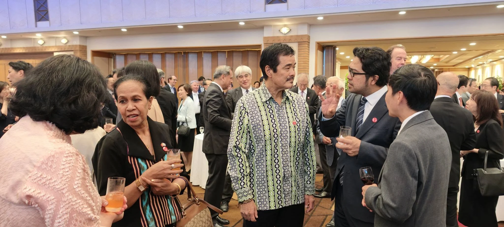 Ambassador Viegas conversing with fellow guests at the reception